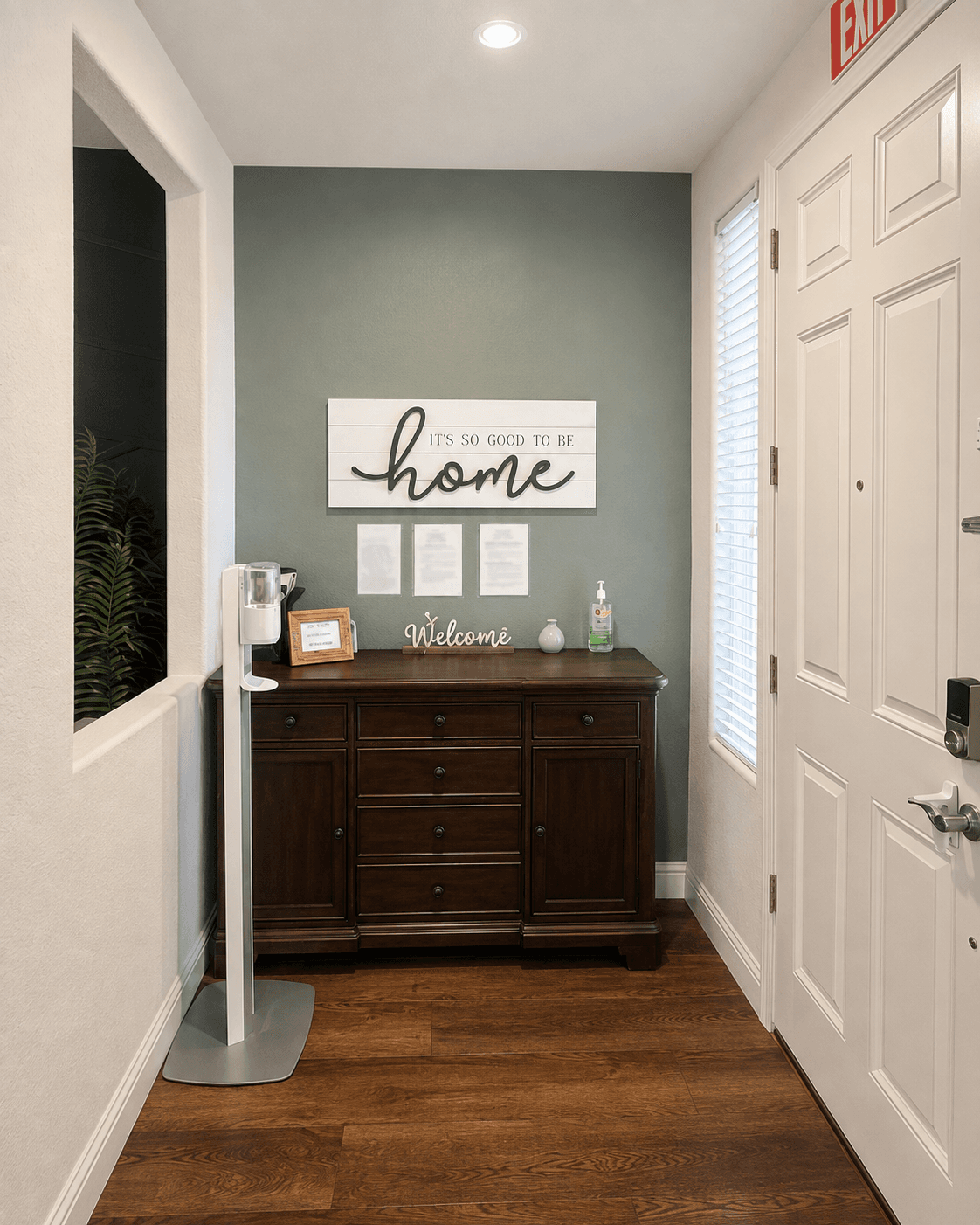 Welcoming entryway at Joy in Caring II with an "it's so good to be home" sign