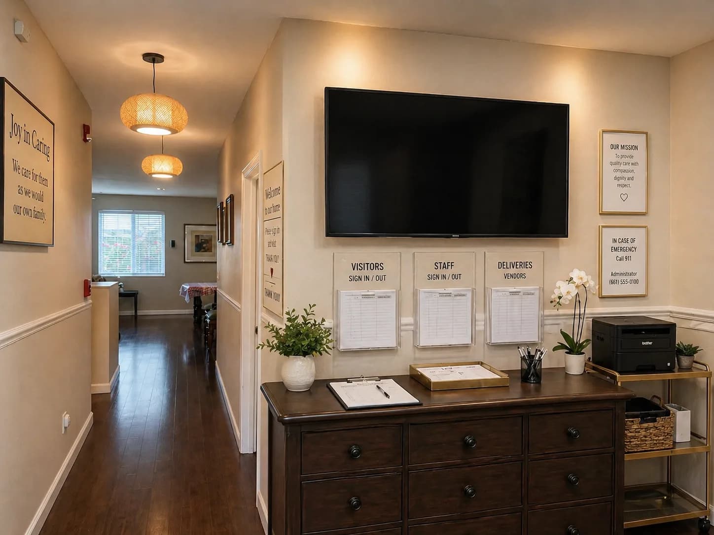 Entry hallway at Joy in Caring I with a visitor/staff sign-in station and welcome message